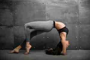 Free photo girl in gym doing yoga