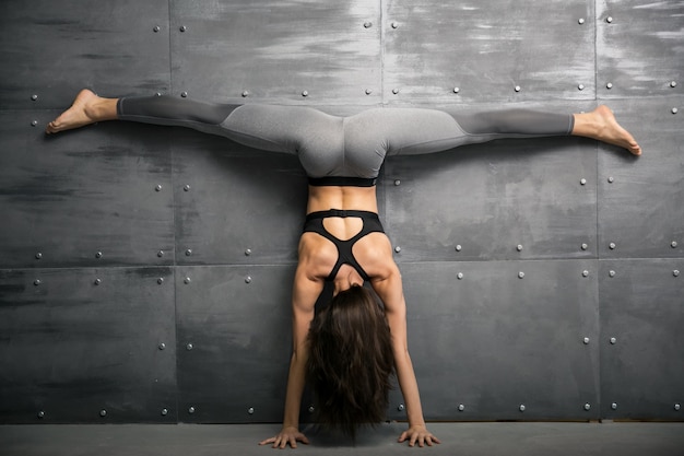 Girl in gym doing yoga