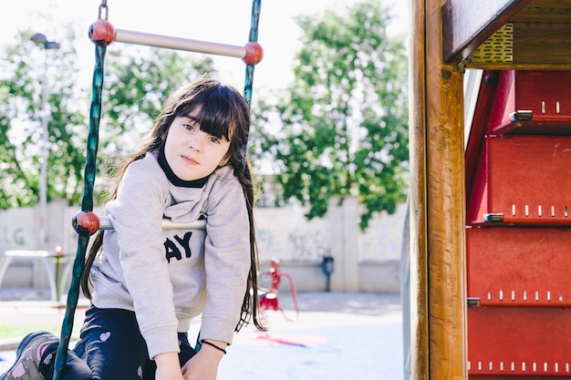 Free photo girl hanging on ladder