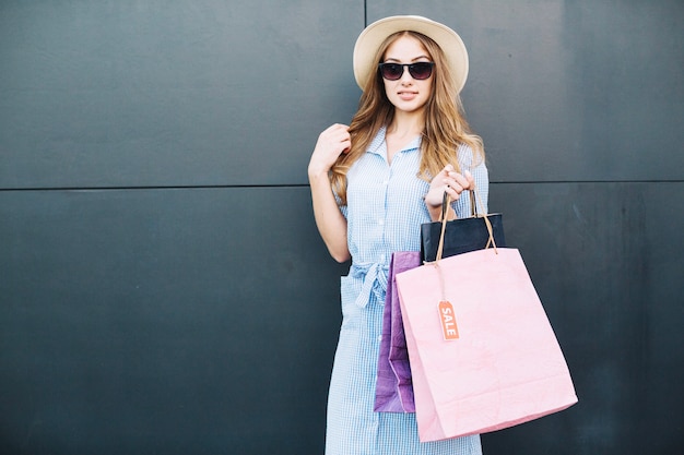 Girl in hat after shopping