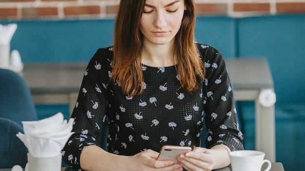 Girl having coffee in a restaurant