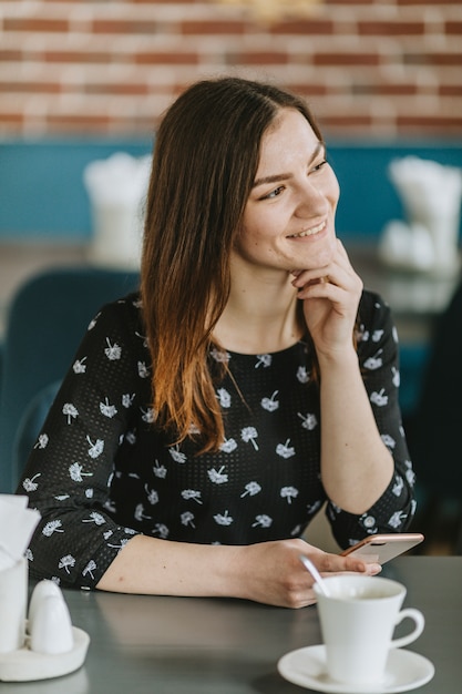 Girl having coffee in a restaurant