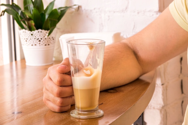 Girl having glass of coffee