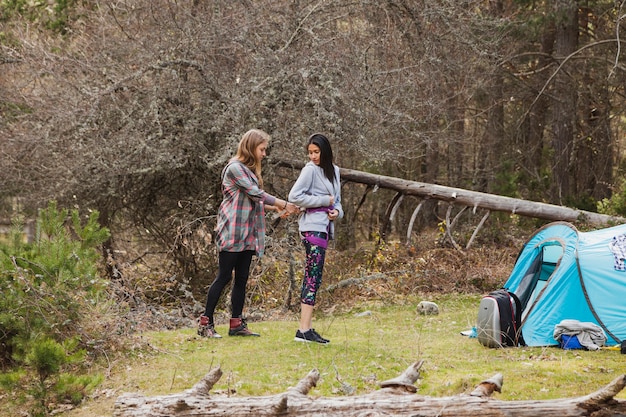 Girl helping her friend with the ropes