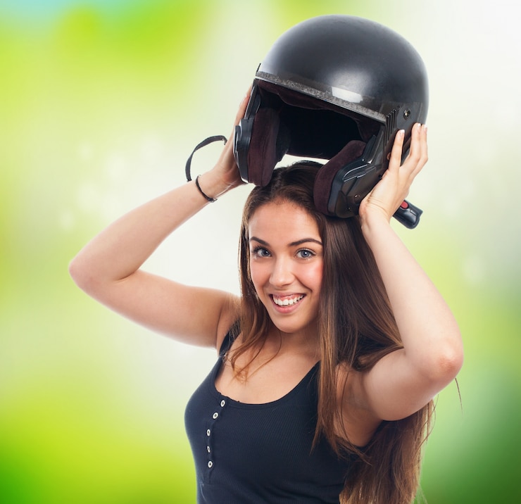 Free Photo girl holding black helmet under head.