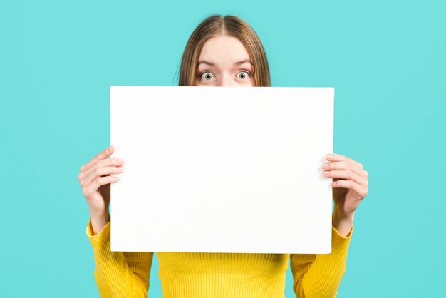 Girl holding blank sign