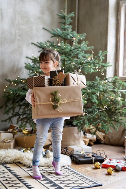 Girl holding Christmas gift boxes