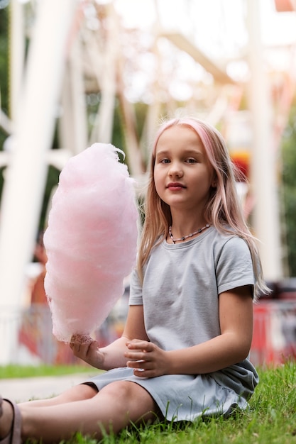 Girl holding cotton candy full shot