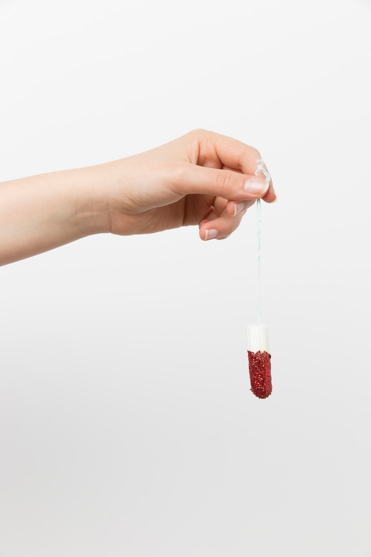 Free Photo girl holding a dirty tampon