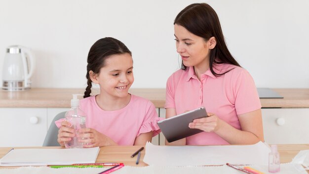 Girl holding disinfectant bottle