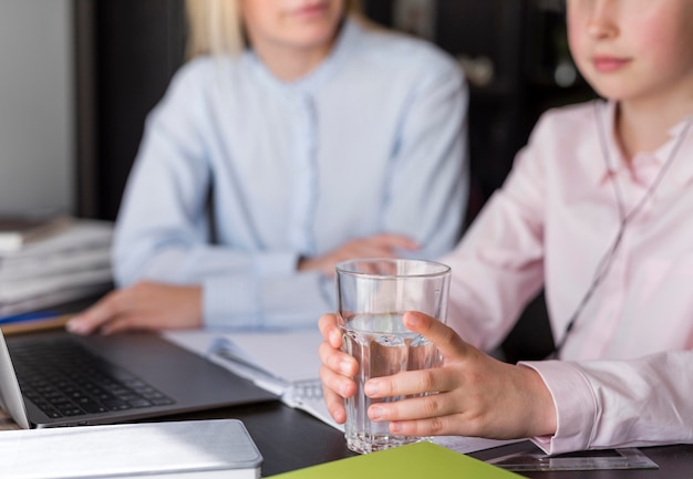 Girl holding a glass of water