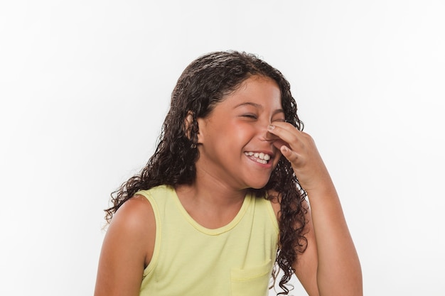 Free photo girl holding her nose due to bad smell