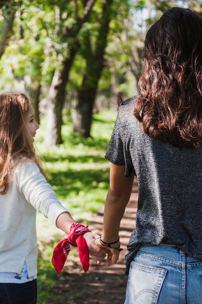 Girl holding her sister's hand