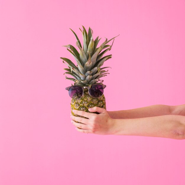 Girl holding pineapple