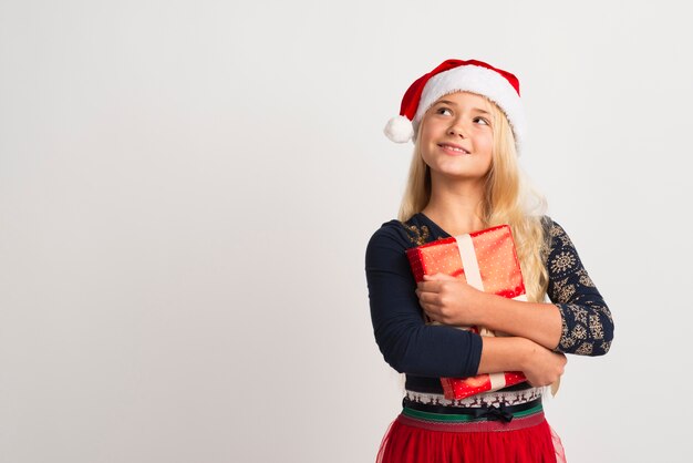 Girl holding present studio shot