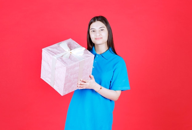 Girl holding a purple gift box