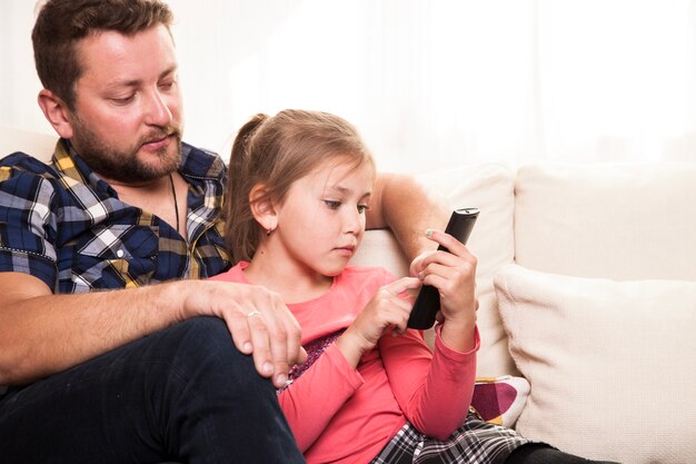 Girl holding the remote control