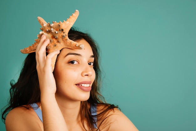 Free photo girl holding starfish