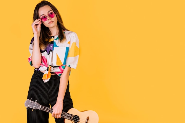 Free photo girl holding an ukelele