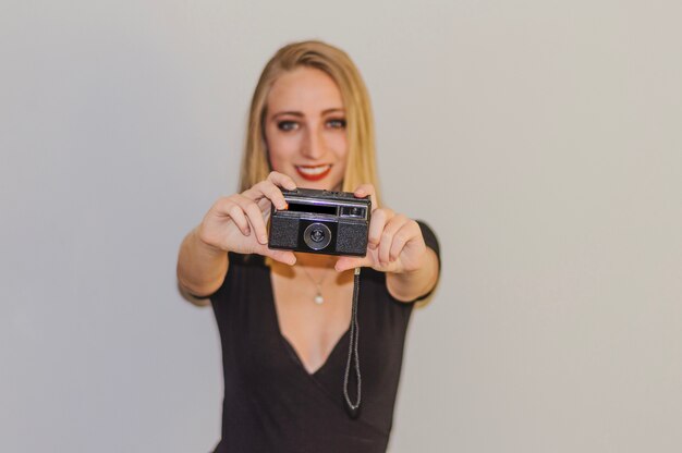 Girl holding vintage camera