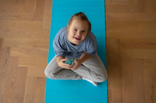 Girl holding water bottle top view