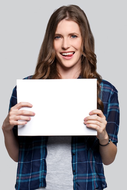 Girl holding white billboard