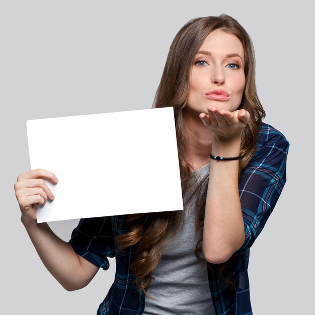 Girl holding white billboard