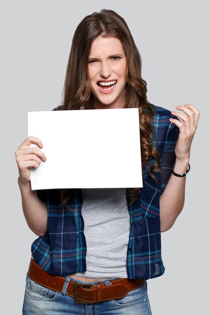 Girl holding white billboard