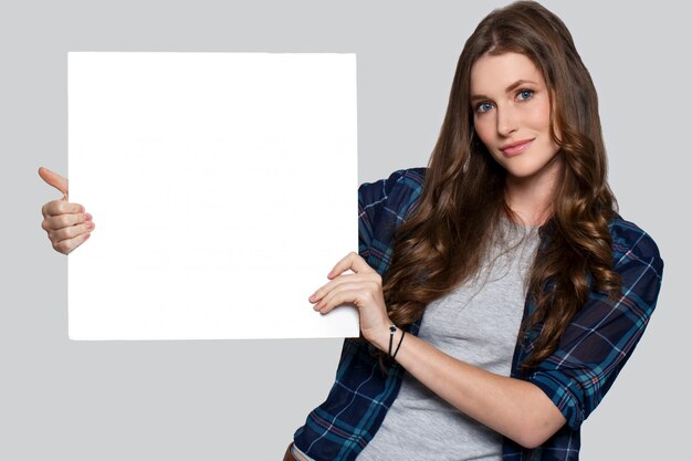 Girl holding white billboard