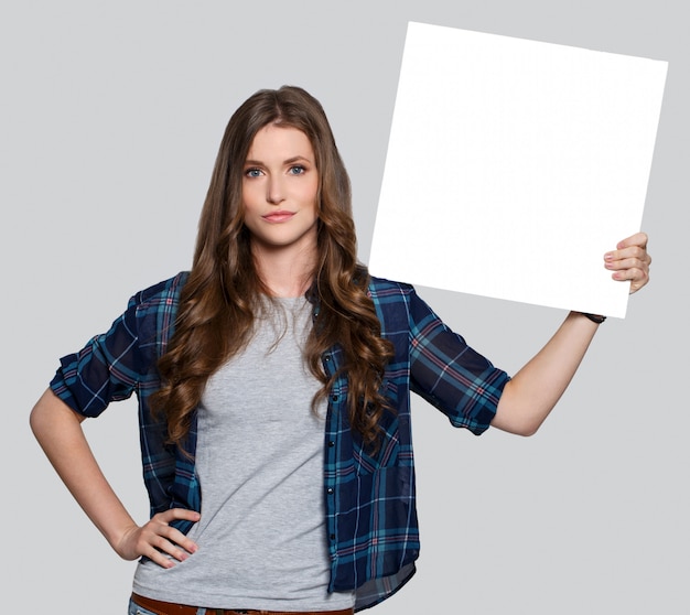 Girl holding white billboard