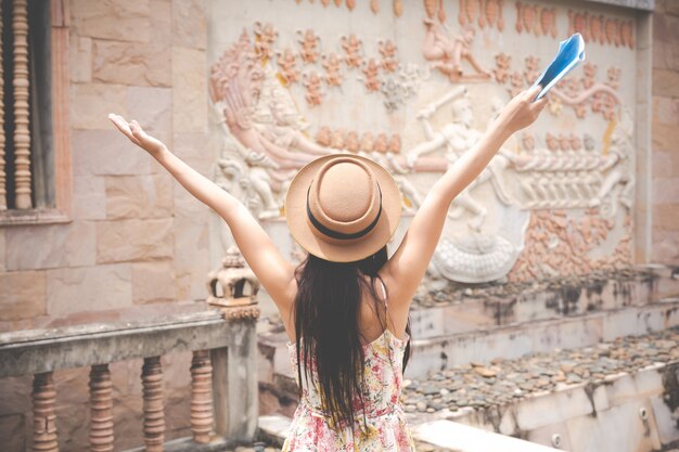 Girl holds a tourist map in the old town.