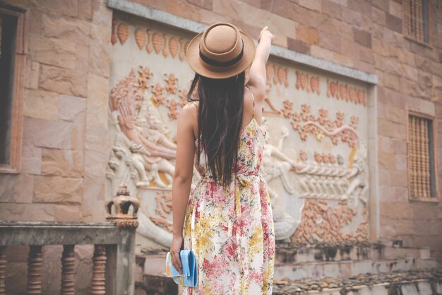 Girl holds a tourist map in the old town.