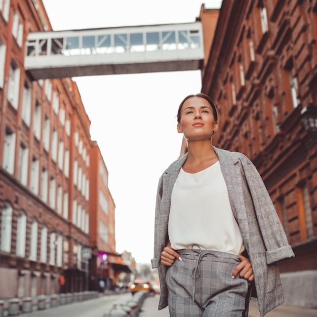 the girl is walking around the city