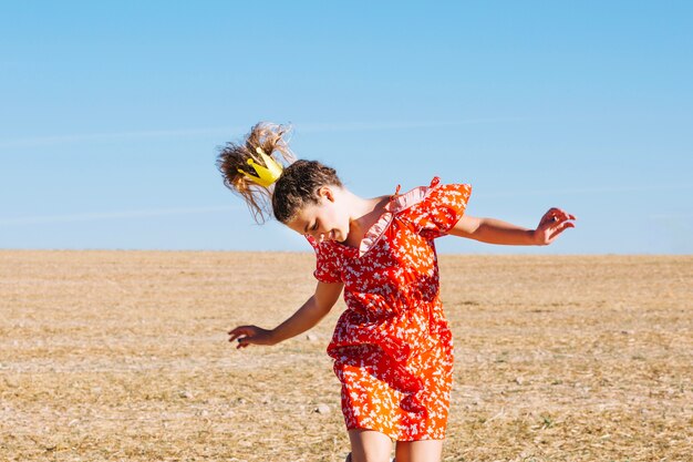 Girl jumping in field