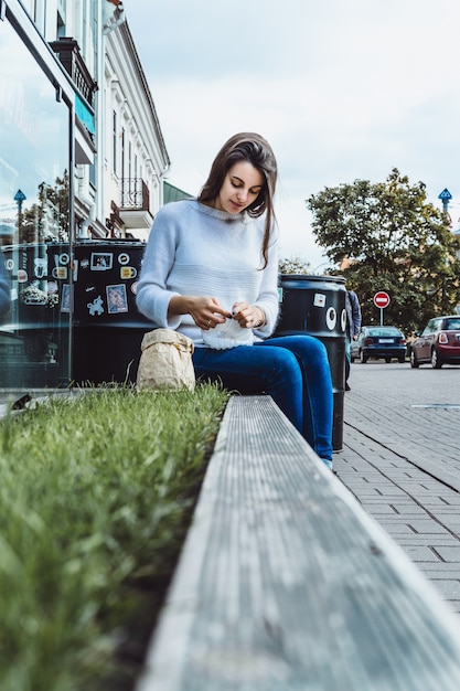 the girl knits in a cafe