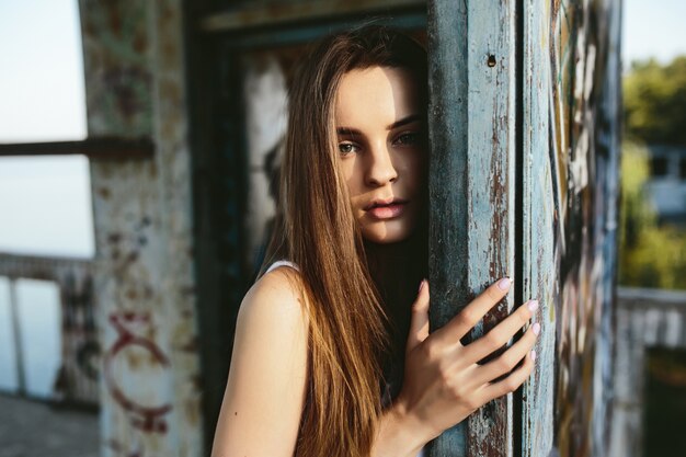 Girl leaning on a column