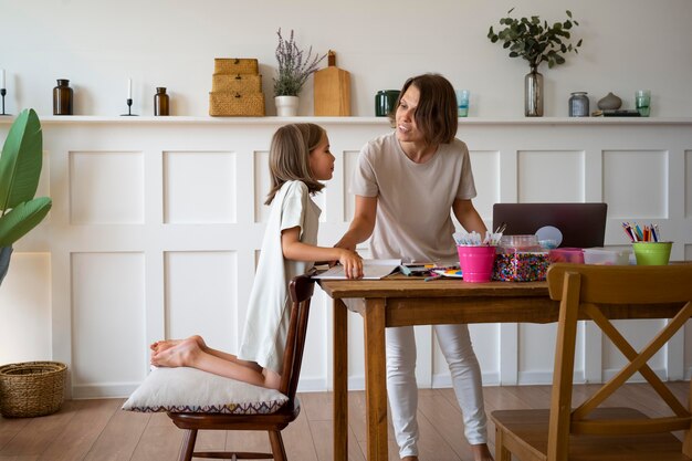 Girl learning at home full shot