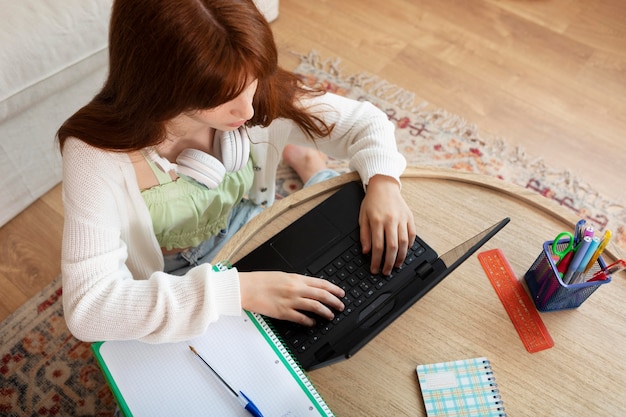 Girl learning online medium shot