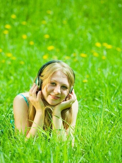 girl listening music in headphones