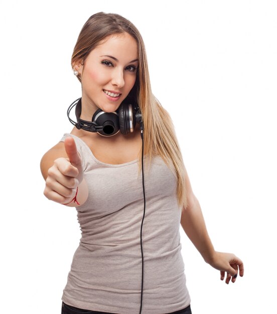 Girl listening music and thumb up