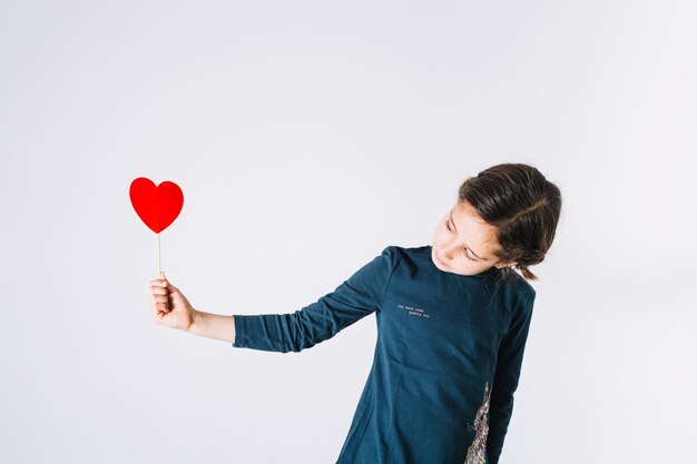 girl looking at heart