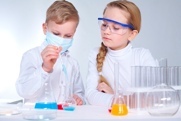 Girl looking at her mate in the laboratory