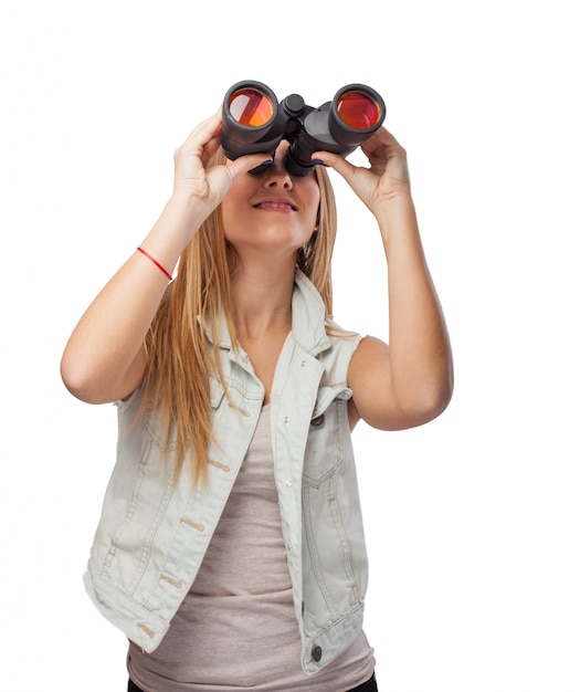 Girl looking through binoculars