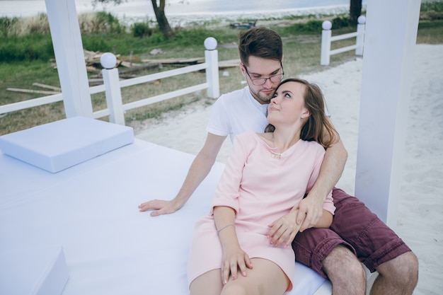 Girl lying on her boyfriend looking at her face