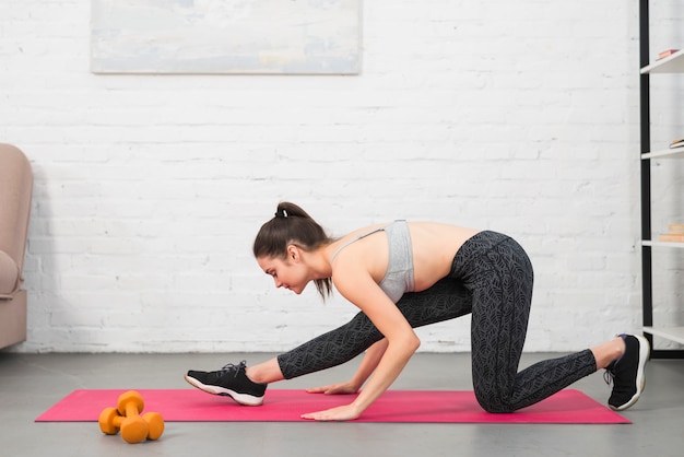 Girl making exercise in her house