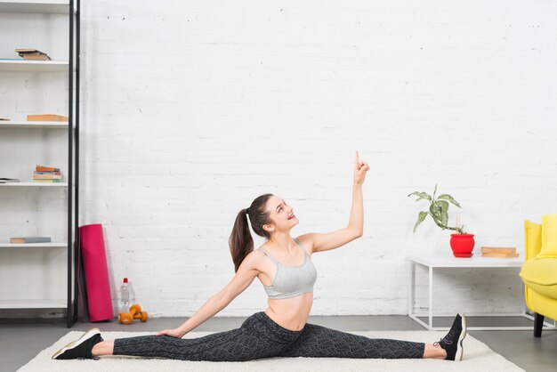 Girl making exercise in her house