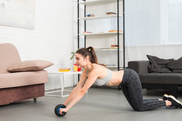 Girl making exercise in her house