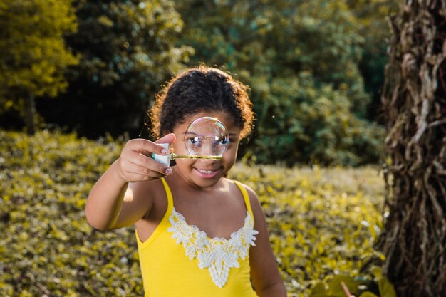 Girl making a soap bubble