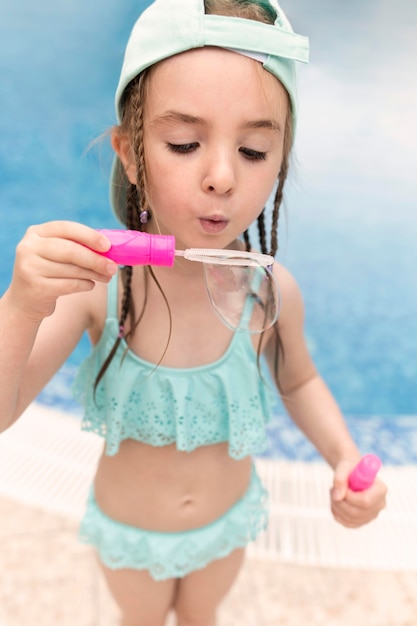 Girl making soap bubbles