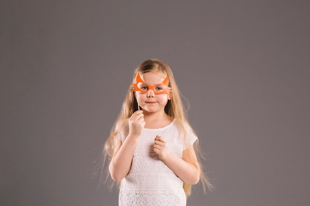 Free photo girl in mask looking at camera